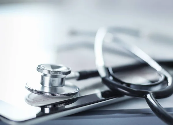 Medical equipment: blue stethoscope and tablet on white background. Medical equipment — Stock Photo, Image