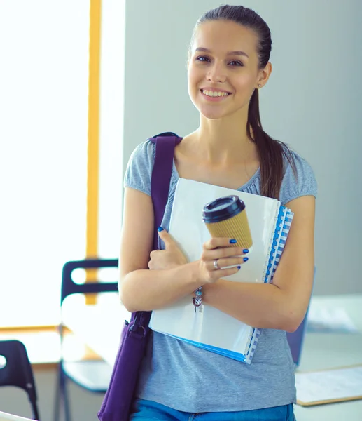 Portrait of young student woman holding exercise books. Student woman — Stock Photo, Image