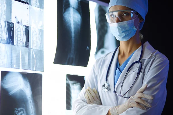 Image of attractive woman doctor looking at x-ray results. — Stock Photo, Image