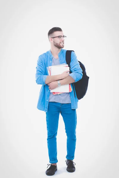 Um estudante do sexo masculino com um saco escolar com livros isolados sobre fundo branco. Oportunidades educativas. Estudante universitário . — Fotografia de Stock