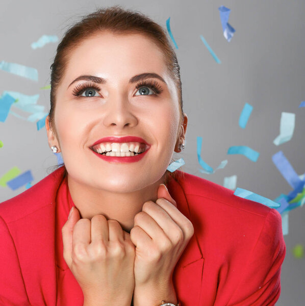 Portreit beautiful happy woman at celebration party with confetti .Birthday or New Year eve celebrating concept.