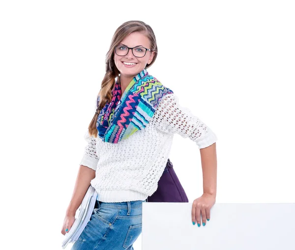 Hermosa estudiante señalando en el tablero en blanco. Estudiante . — Foto de Stock