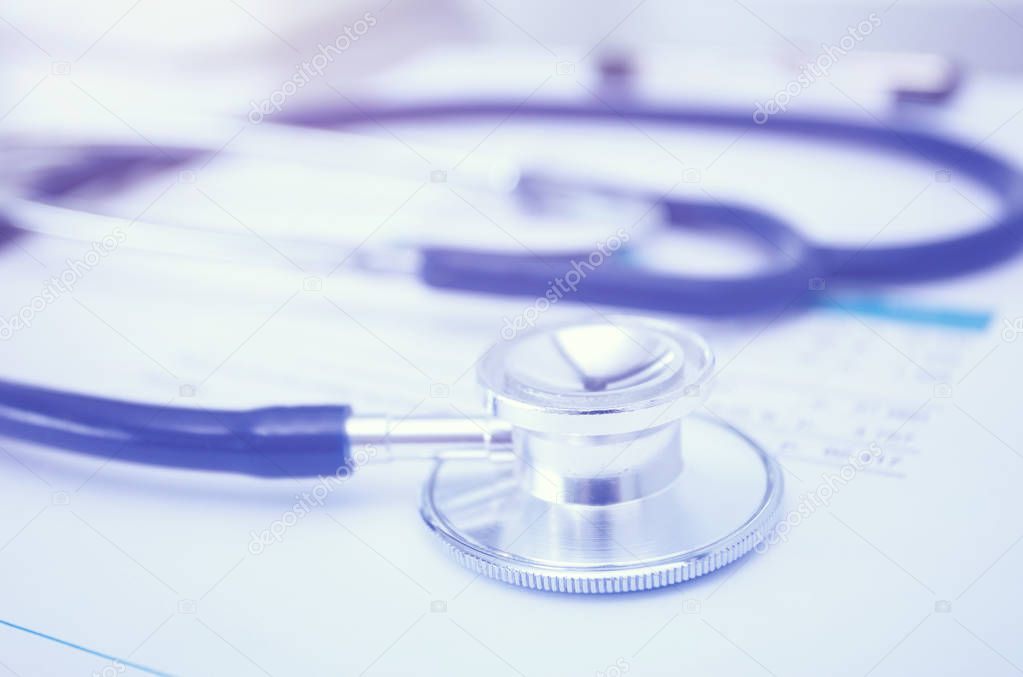 Medical equipment: blue stethoscope and tablet on white background. Medical equipment