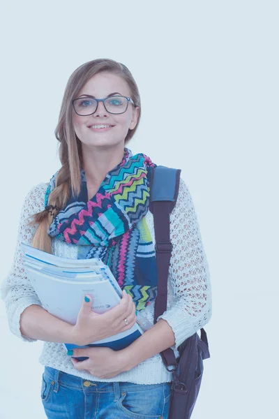 Retrato de una joven estudiante sosteniendo libros de ejercicios. Estudiante. Universidad — Foto de Stock