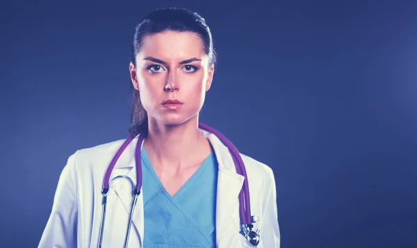 Portrait of young woman doctor with white coat standing in hospital . Portrait of young woman doctor — Stock Photo, Image