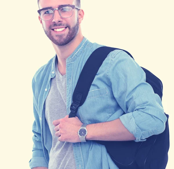 Um estudante do sexo masculino com um saco escolar com livros isolados sobre fundo branco. Oportunidades educativas. Estudante universitário . — Fotografia de Stock