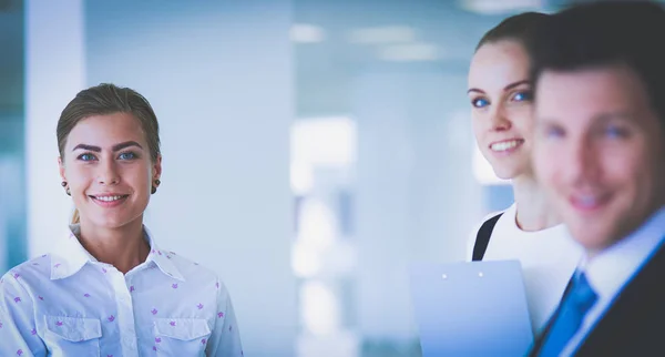 Smiling successful business team standing in office — Stock Photo, Image