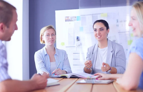 Young people studying with books on desk. Beautiful women and men working together. — Stock Photo, Image