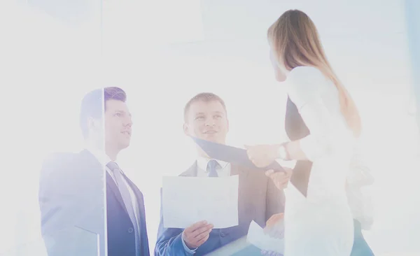 Portrait of young businessman in office with colleagues in the background . Portrait of young businessman. — Stock Photo, Image