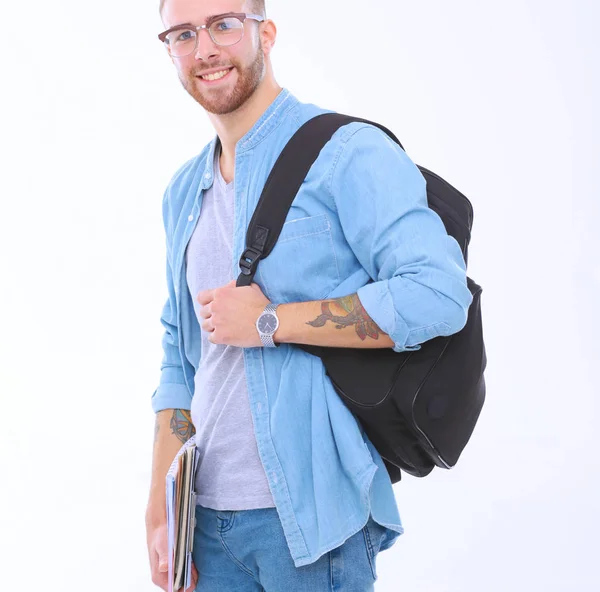 Uno studente di sesso maschile con una borsa della scuola che tiene libri isolati su sfondo bianco. Opportunità di istruzione. Studente universitario . — Foto Stock