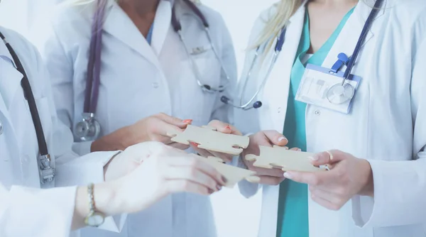 Doctors and nurses in a medical team stacking hands — Stock Photo, Image