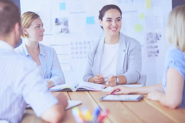 Young people studying with books on desk. Beautiful women and men working together. — Stock Photo, Image