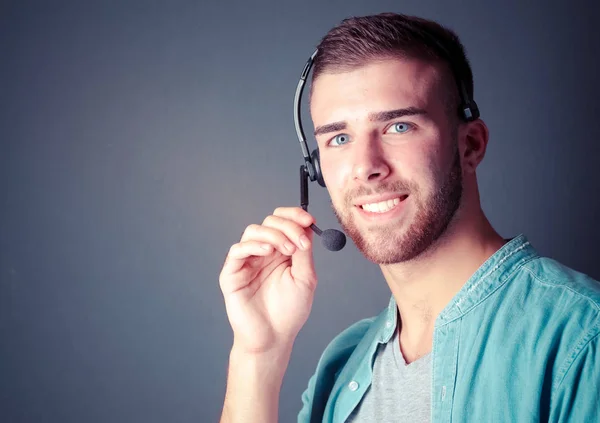 Portrait of young male with microphone. Call-center assistant. Help desk worker. — Stock Photo, Image