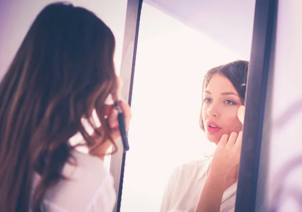 Young woman looking herself reflection in mirror at home. Young woman. — Stock Photo, Image