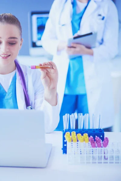 Two young female doctors at medical laboratory with tests. — Stock Photo, Image