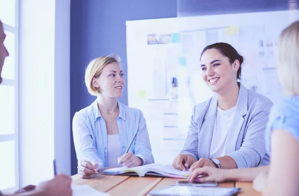 Young people studying with books on desk. Beautiful women and men working together. — Stock Photo, Image