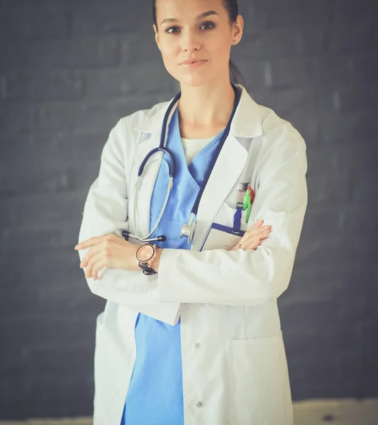 Young woman doctor sitting with your phone. Woman doctors. — Stock Photo, Image