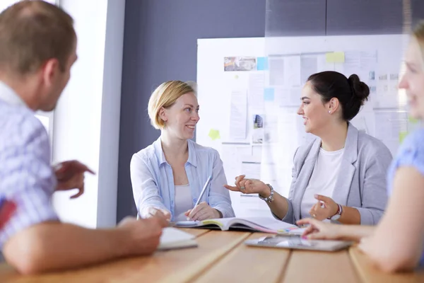 Young people studying with books on desk. Beautiful women and men working together. — Stock Photo, Image