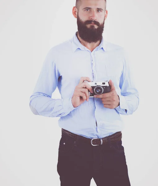 Portrait of a young photographer with a camera, isolated on white background — Stock Photo, Image