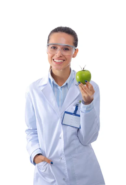 Mosolygó doktornő egy zöld almával. Női orvos — Stock Fotó