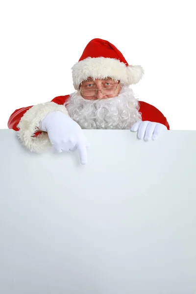Real Santa Claus carrying big bag full of gifts, isolated on white background. Stock Picture