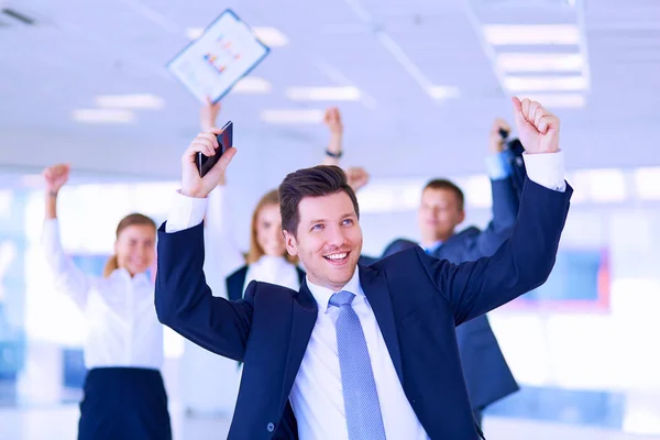 Business team celebrating a triumph with arms up — Stock Photo, Image