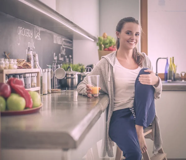 Woman in the kitchen. Cooking at kitchen.