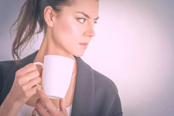 Portrait of young woman with cup tea or coffee — Stock Photo, Image