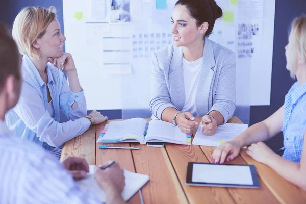 Young people studying with books on desk. Beautiful women and men working together. — Stock Photo, Image