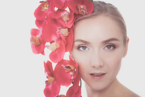 Young beauty woman with flower near face. — Stock Photo, Image