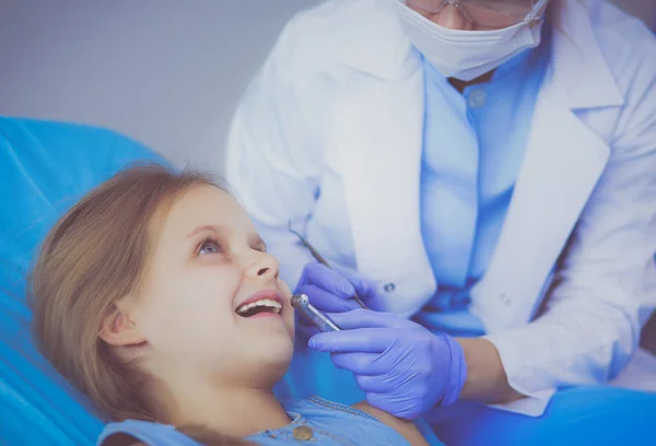 Little girl sitting in the dentists office. — Stock Photo, Image