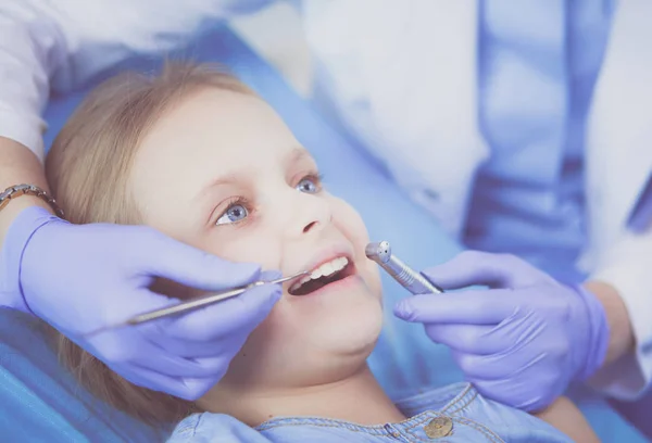 Little girl sitting in the dentists office. — Stock Photo, Image