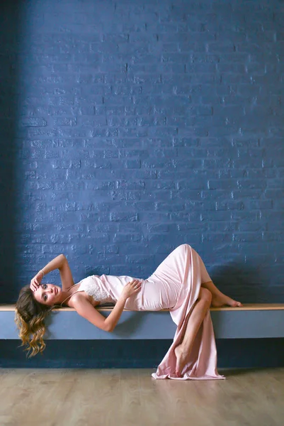 Sexy woman in front of the fireplace. Wood fireplace. — Stock Photo, Image