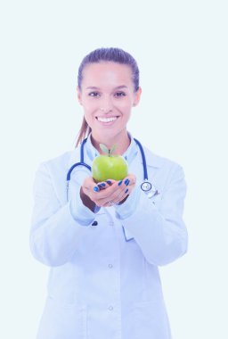 Yeşil elmalı gülümseyen kadın doktor. Kadın doktor