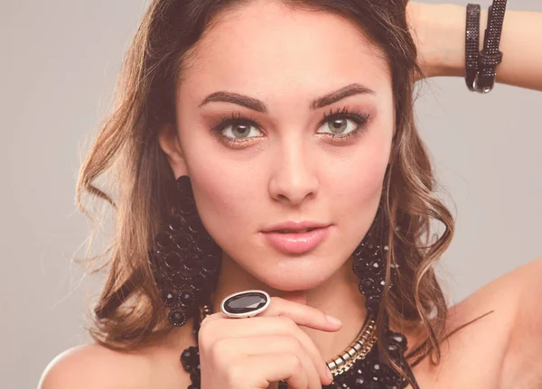 Portrait of beautiful young woman face. Isolated on gray background. — Stock Photo, Image