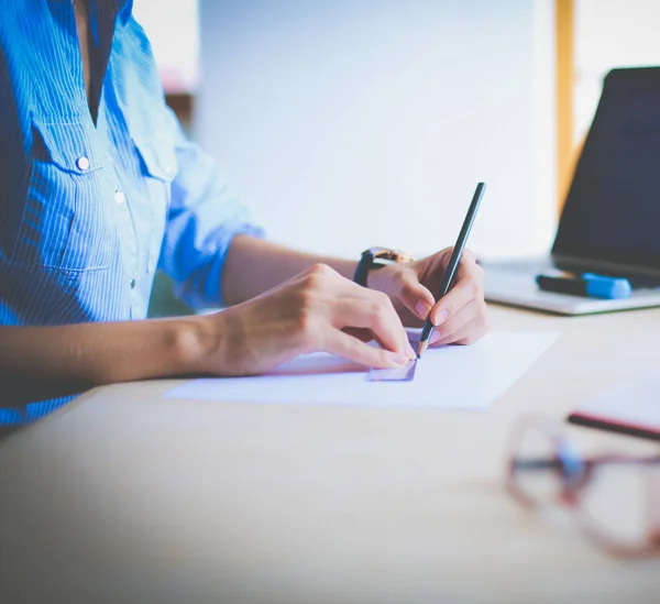 Young woman sitting at office table with laptop. Young woman. Laptop — Stock Photo, Image