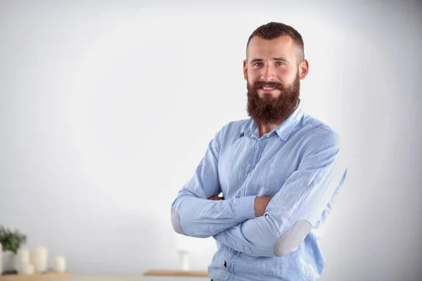 Successful young business man standing in office — Stock Photo, Image