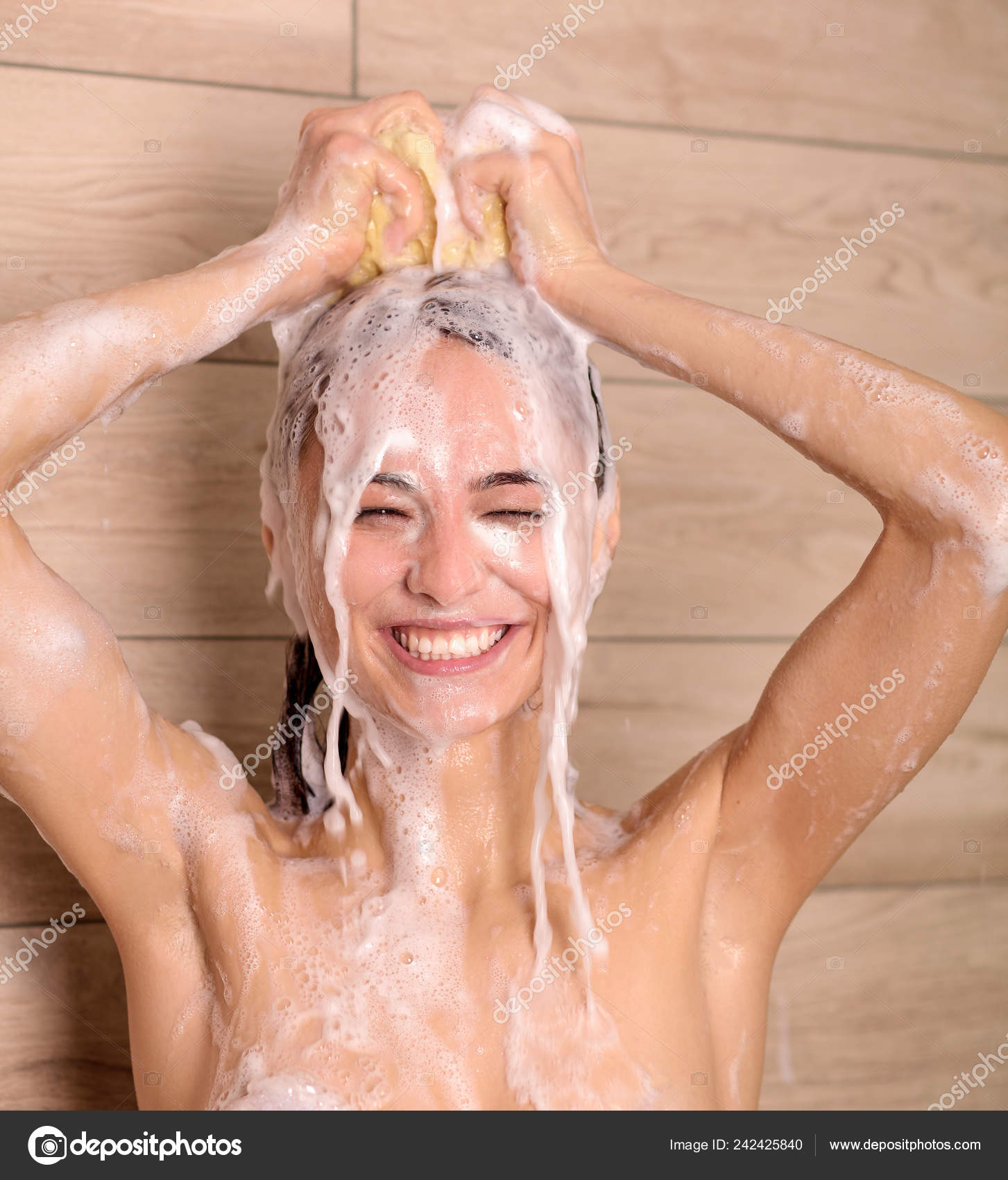 Young beautyful woman under shower in bathroom. Stock Photo by  ©Lenets_Tatsiana 242425840