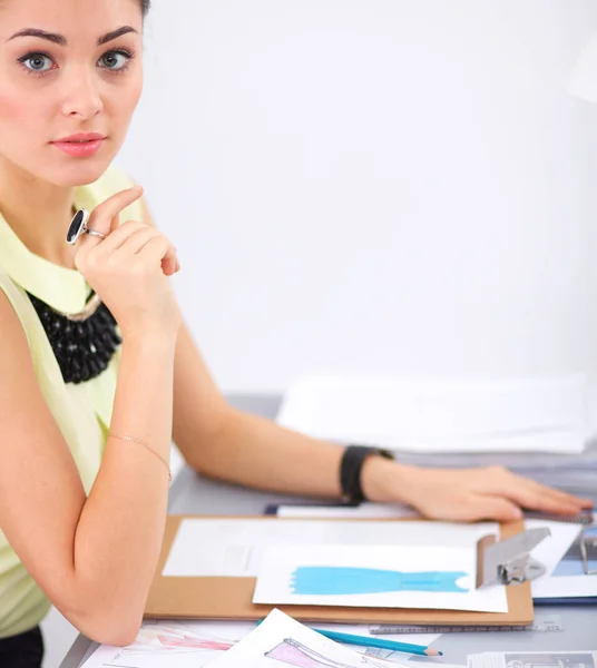 Young fashion designer with folder working at studio — Stock Photo, Image