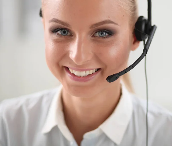 Close-up portrait of a customer service agent sitting at office