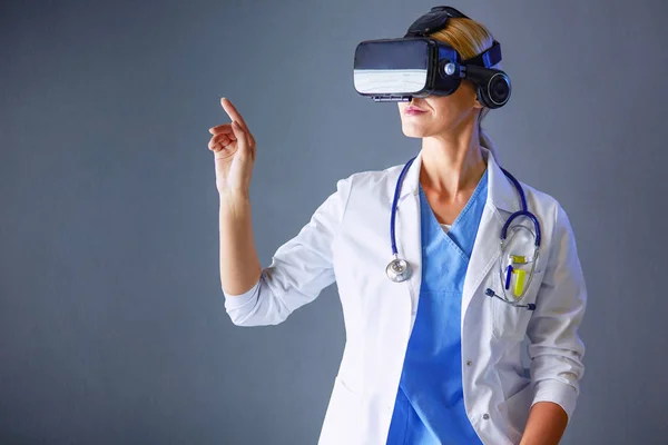 Female doctor wearing virtual reality glasses isolated on white background. — Stock Photo, Image