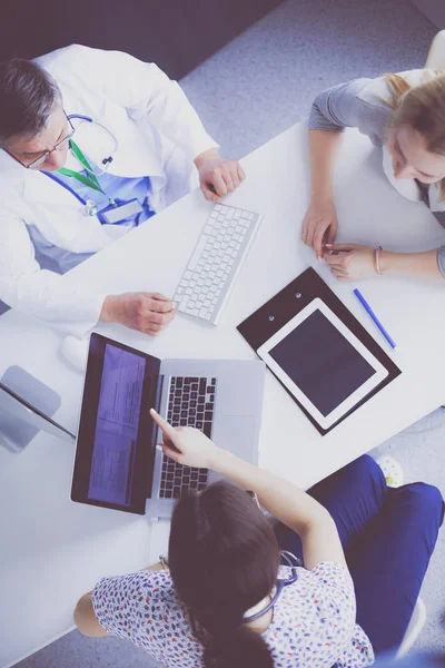 Doctor and patient discussing something while sitting at the table . Medicine and health care concept — Stock Photo, Image