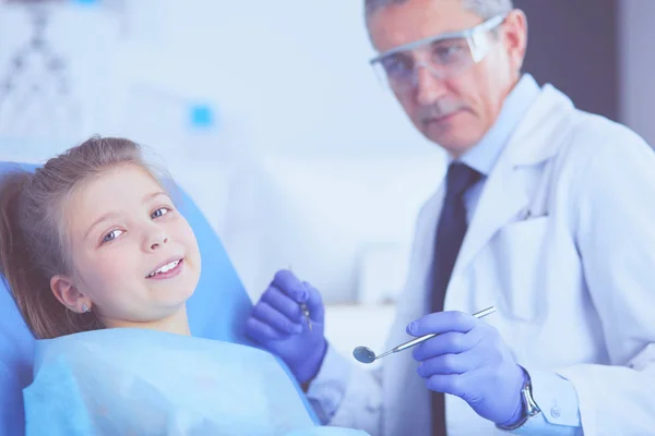 Little girl sitting in the dentists office — Stock Photo, Image