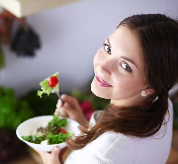 Young woman standing near desk in the kitchen. Young woman . — Stock Photo, Image