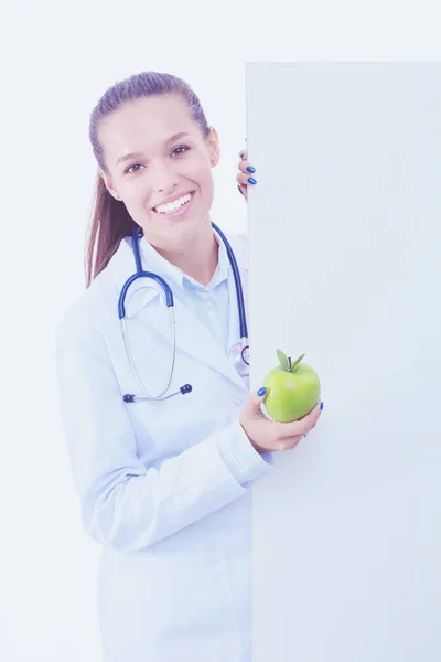 Smiling doctor with apple and blank banner. Woman doctors. — Stock Photo, Image