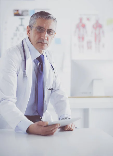 Portrait of a smiling doctor in his bright office — Stock Photo, Image