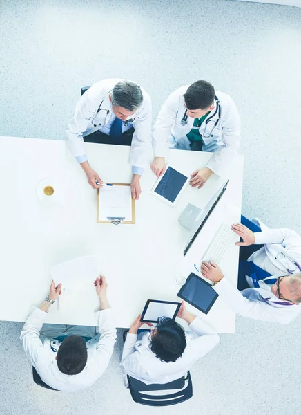 Medical team sitting and discussing at table, top view — Stock Photo, Image