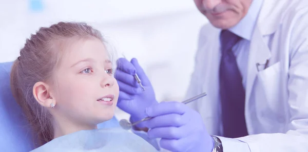 Little girl sitting in the dentists office — Stock Photo, Image