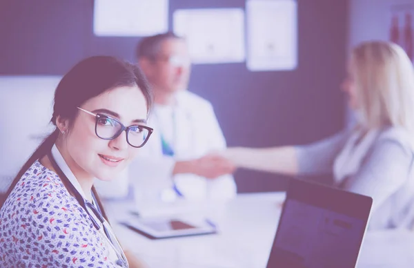 Doctor and patient discussing something while sitting at the table . Medicine and health care concept — Stock Photo, Image