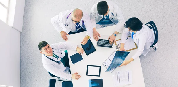 Medical team sitting and discussing at table, top view — Stock Photo, Image